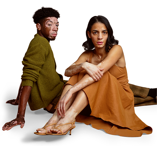 Man and woman with vitiligo sitting down